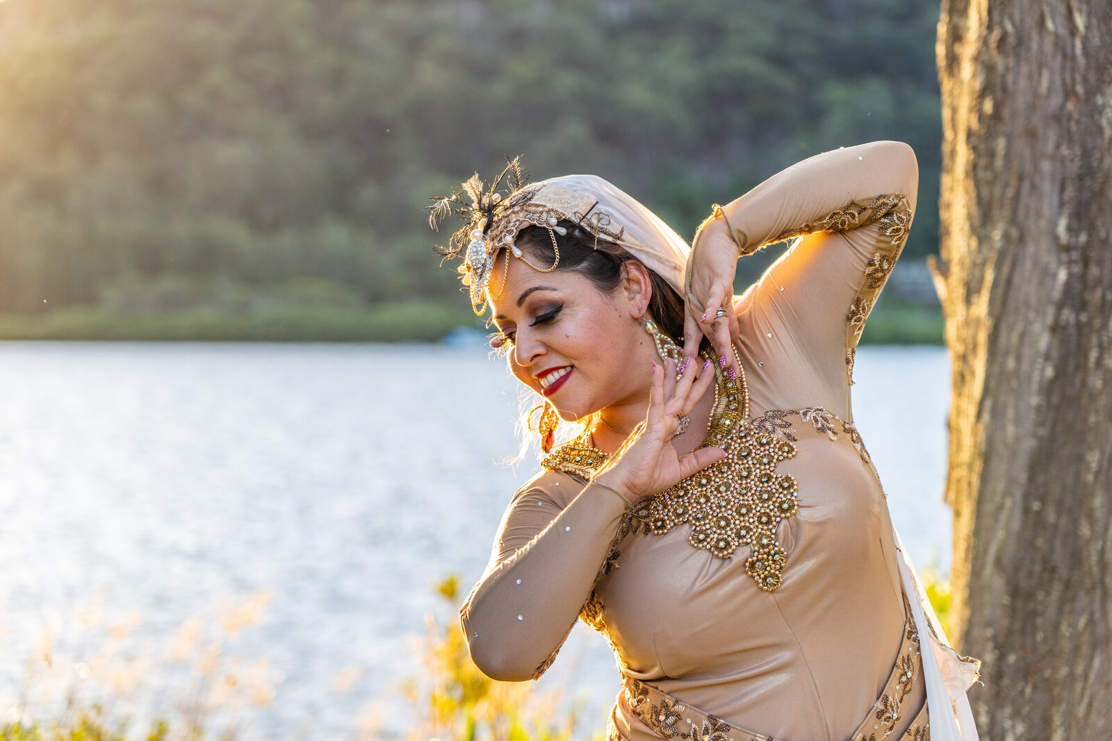 Jrisi performing a solo Persian dance in gold costume