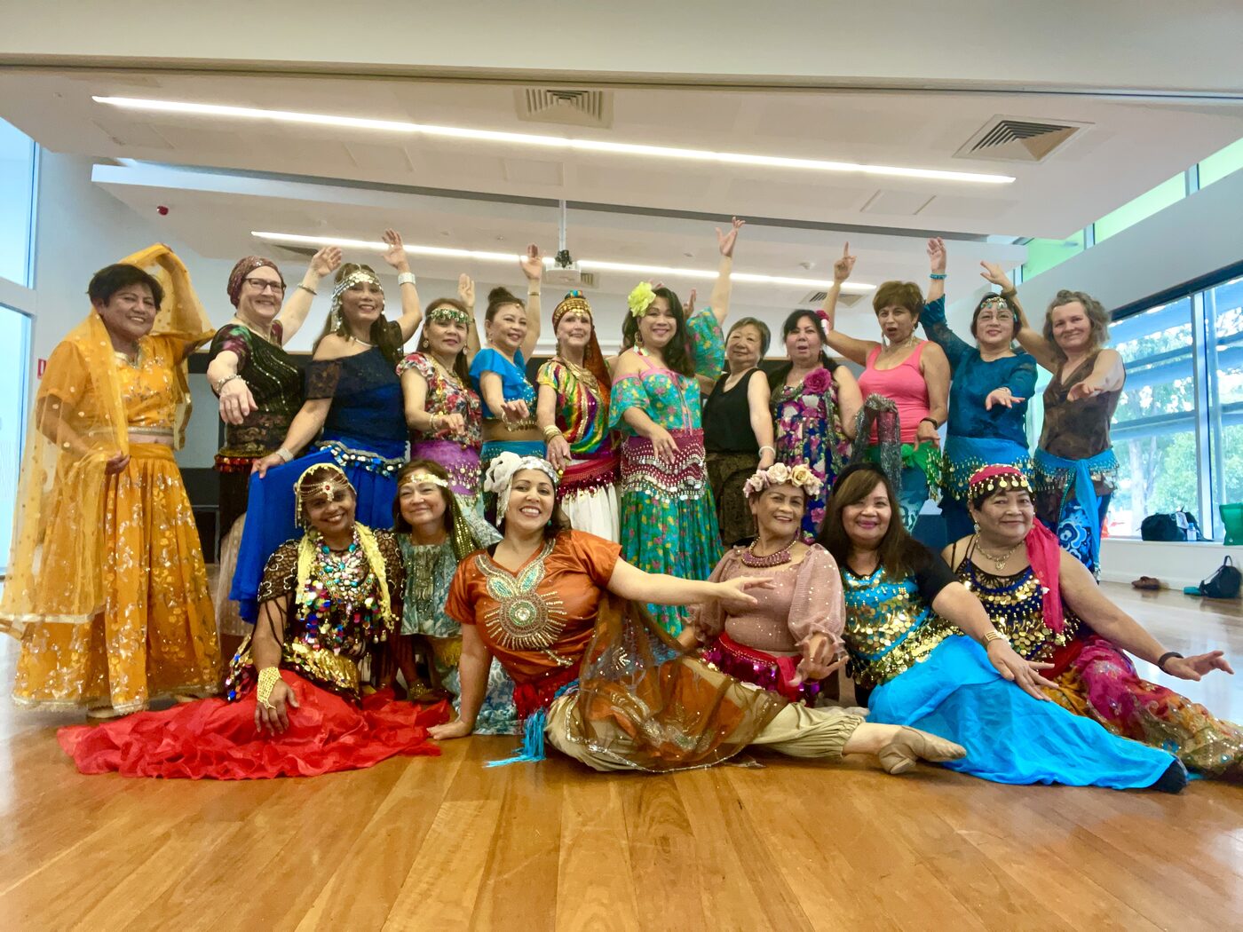 Community dance group at WASH House, in colourful costume
